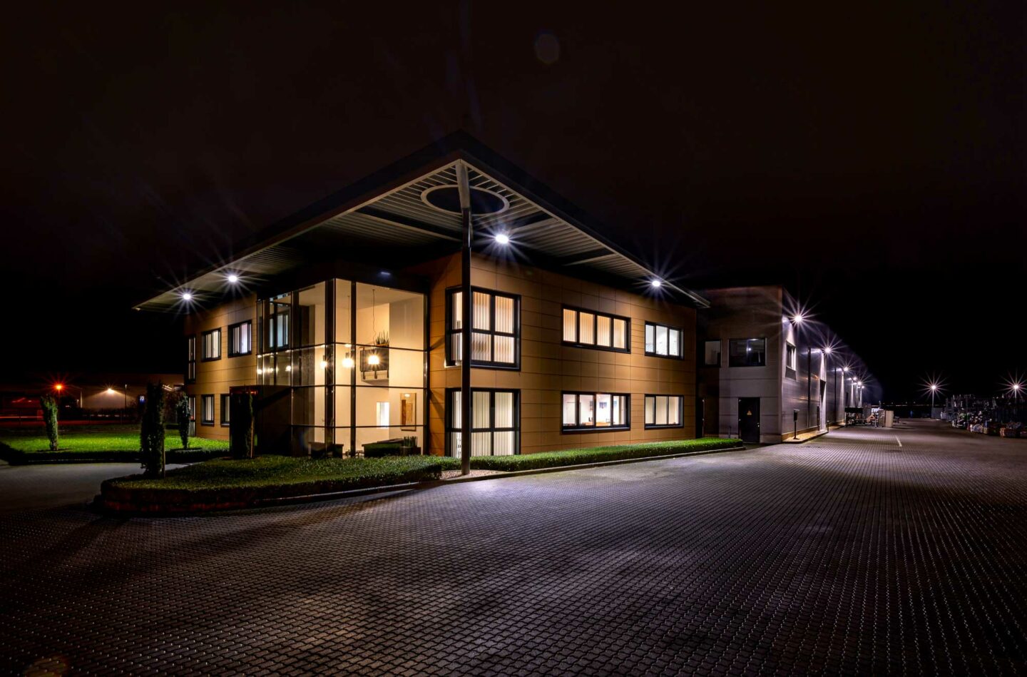 Hillebrandt Company premises Greven Mergenthalerstrasse 43 lit at night